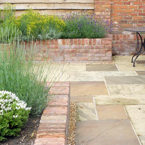 Modern Cottage Garden York stone paths and local brick walling